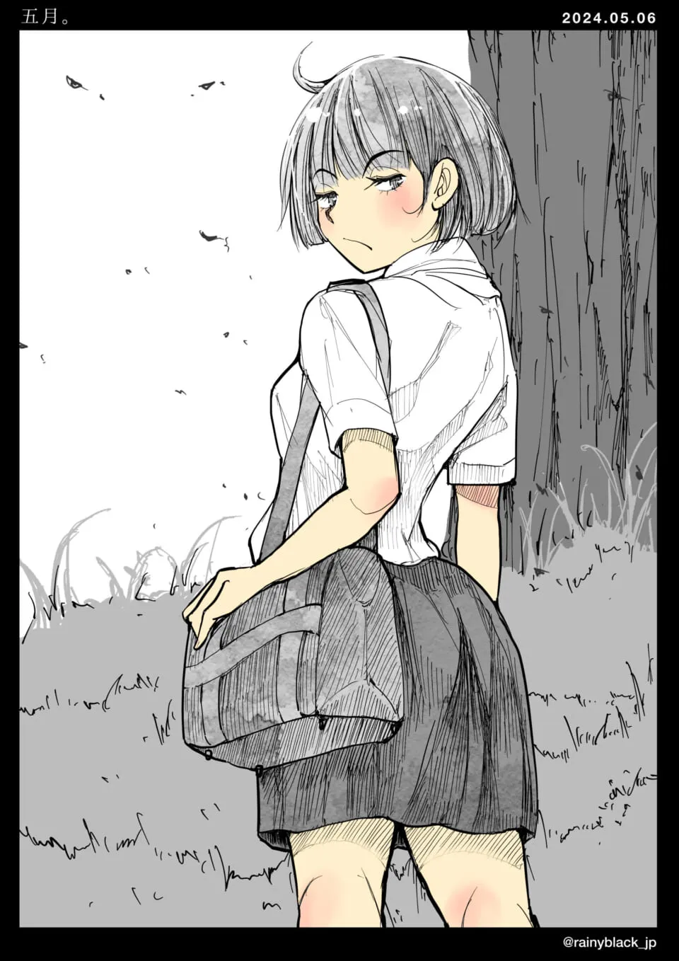 手に鞄を持ち振り返る女子学生